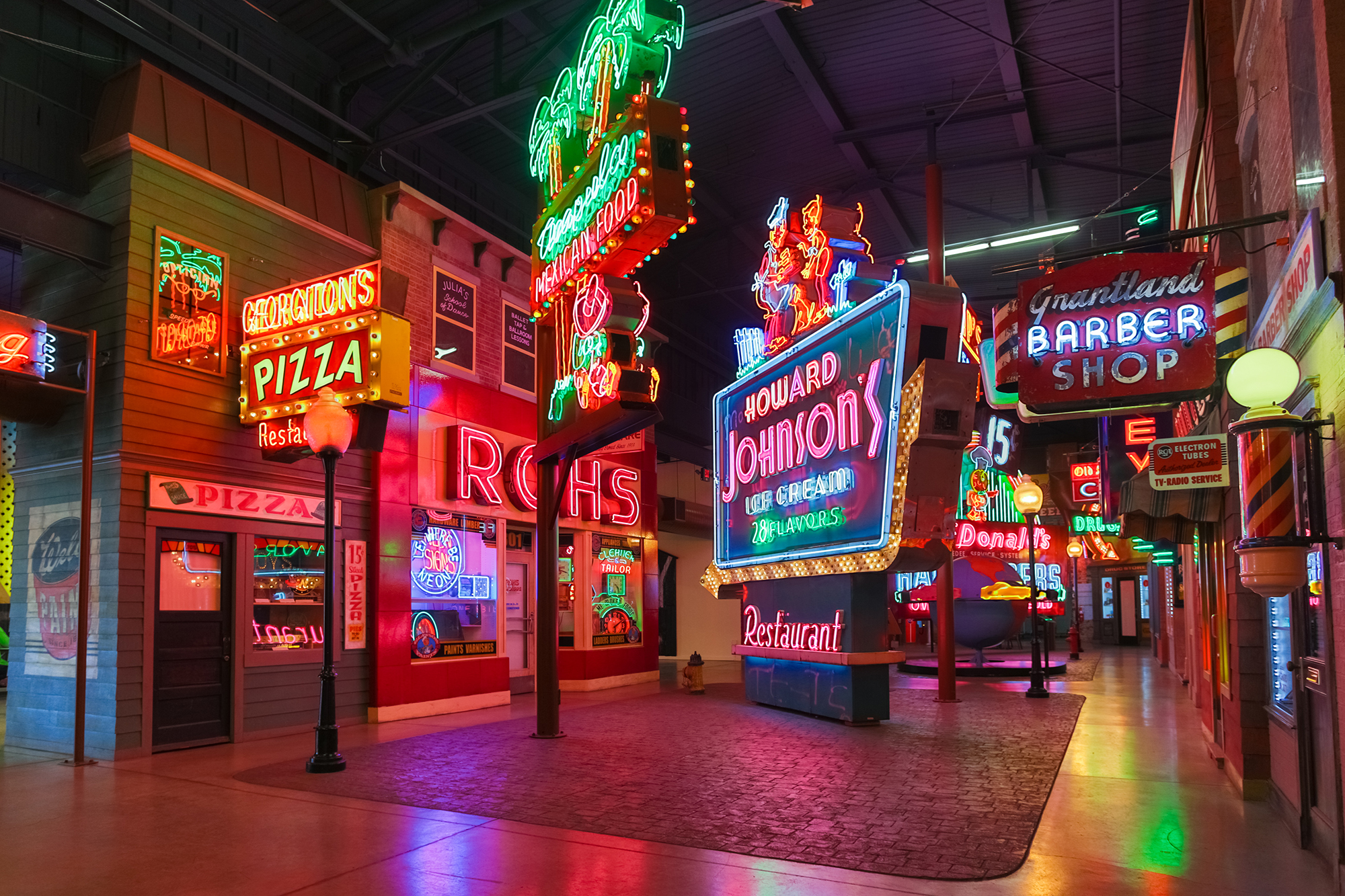 Main hall of the American Sign Museum — vintage neon signs and the Big Boy statue