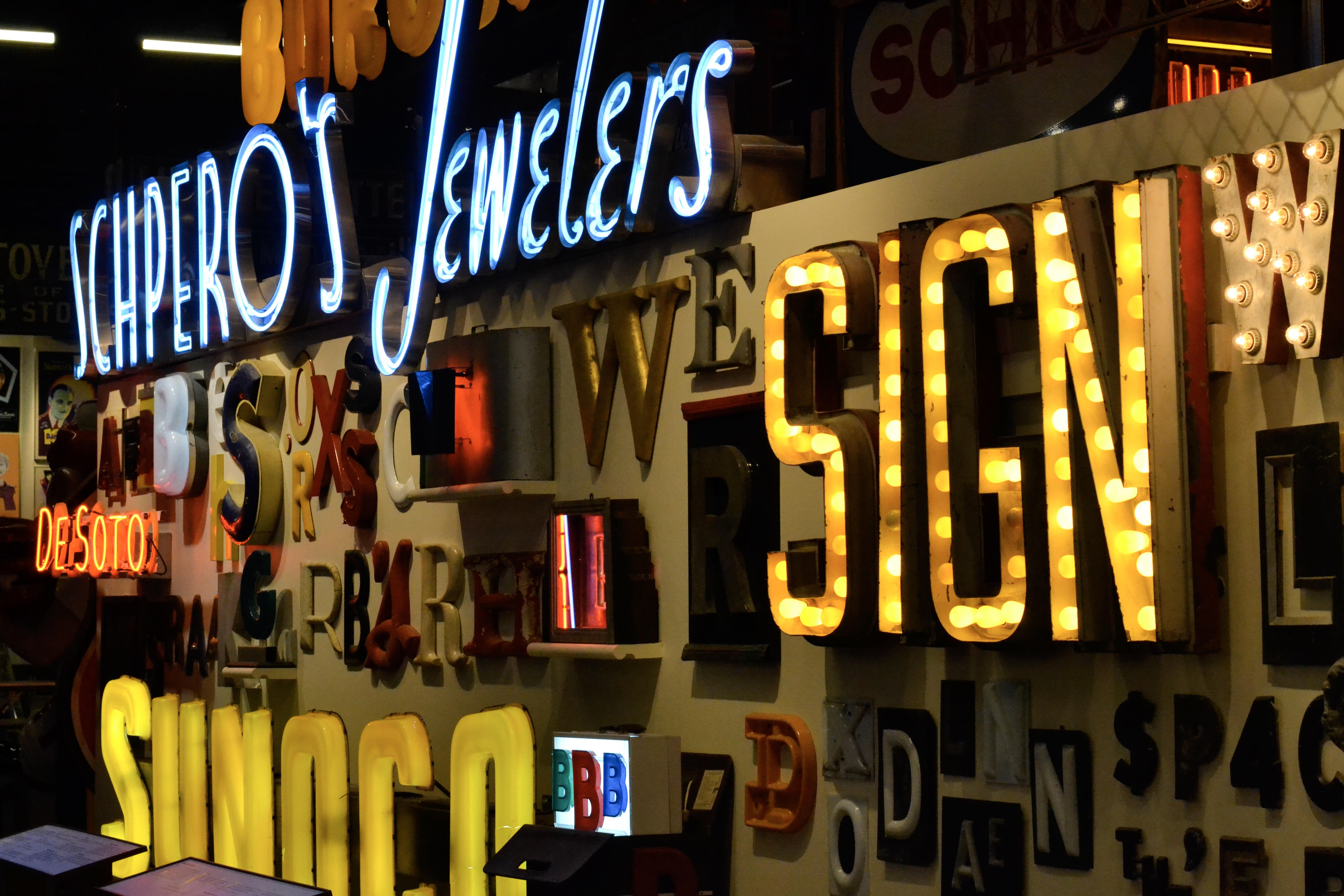 Wall of vintage sign letters and neon at the American Sign Museum